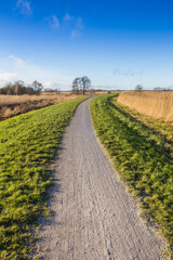 Fototapeta na wymiar Walking path at the Schildmeer lake in Groningen, Netherlands