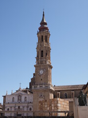Fototapeta na wymiar Scenic cathedral of the Savior in Saragossa city in Spain on main market square in european city at Aragon district, clear blue sky in 2019 warm sunny summer day on September - vertical.