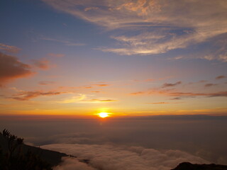 sunrise over sea of clouds