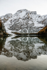 Fototapeta na wymiar winter landscape, with kaleidoscope effect on the side di braies located in the Italian alps in the area of ​​the dolomites. Snow, trees and mountains 
