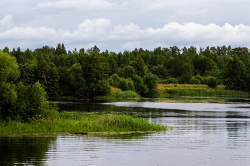 Fototapeta na wymiar Silent small river Nerl on a cloudy summer weather