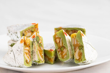 Kaju Diamond Barfi Or Burfi Made Of Dry Fruits Like Badam Almonds Kaaju Mava Cashew Nuts Pista Kesar Doodh Condensed Milk Ghee Mawa Served In Plate. White Background With Copy Space For Text