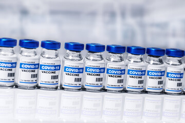 covid-19 vaccine - coronavirus vaccination bottles. injection vials in a row in laboratory