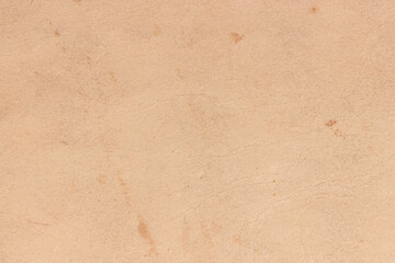 Old yellowed paper with spots on the cover of the book.