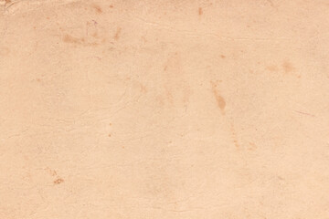Old yellowed paper with spots on the cover of the book.
