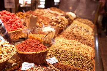 nuts and dried fruits on the counter in the market