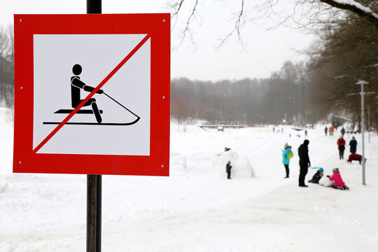 No Sledding Sign In The Snowy Park. Children Safety During Winter Holidays