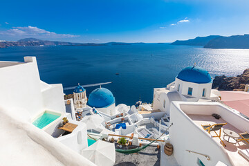 Santorini island, Greece. Incredibly romantic summer landscape on Santorini. Oia village in the morning light. Amazing view with white houses. Island of lovers, vacation and travel background concept
