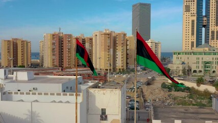 Libyan flag flying over the capital of Libya, Tripoli