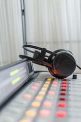 sound mixer and headphones in radio studio