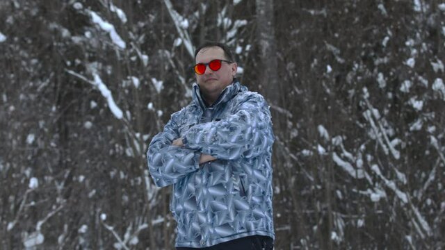 Man stands alone against white snowstorm and snow storm, a snowfall.