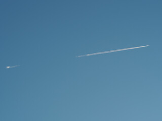 Jet fly across cloudless sky