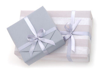 Two gray gift boxes with gray ribbon.