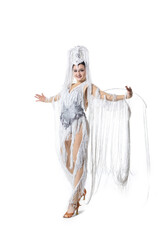 Gorgeous. Beautiful young woman in carnival, stylish masquerade costume with feathers dancing on white studio background. Concept of holidays celebration, festive time, dance, party, fashion