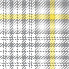 Plaid pattern in grey, yellow, white. Glen checked plaid tartan background texture for jacket, skirt, trousers, blanket, or other modern spring summer tweed textile design.