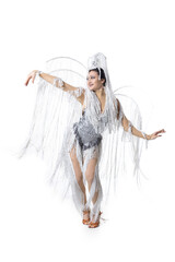 Silver. Beautiful young woman in carnival, stylish masquerade costume with feathers dancing on white studio background. Concept of holidays celebration, festive time, dance, party, fashion
