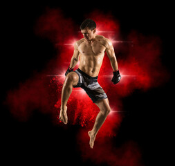 Fototapeta na wymiar MMA fighter jumping with a knee kick