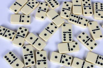A game of dominoes on a light background. Close-up. Selective focus.