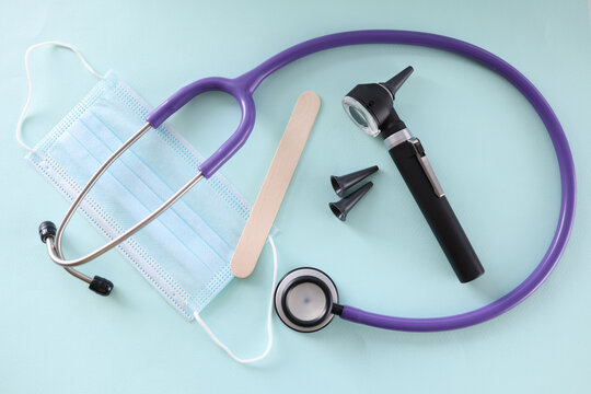 On Table Is Protective Otoscope Mask And Throat Shelf