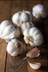 Garlic bulbs on wooden background.