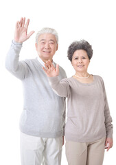 Oriental old couple waving