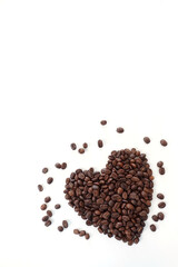 Heart Shaped Coffee beans white background isolated, top view.