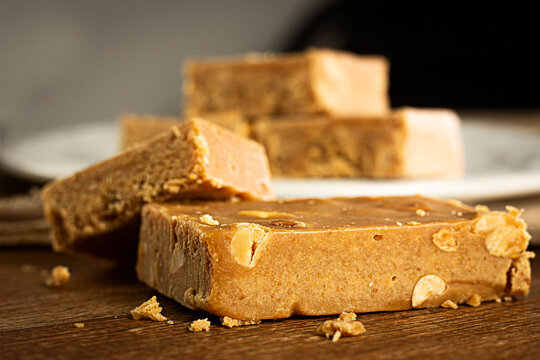 Pa&ccedil;oca, Brazilian Typical Peanut Candy on Wooden Table and a Plate