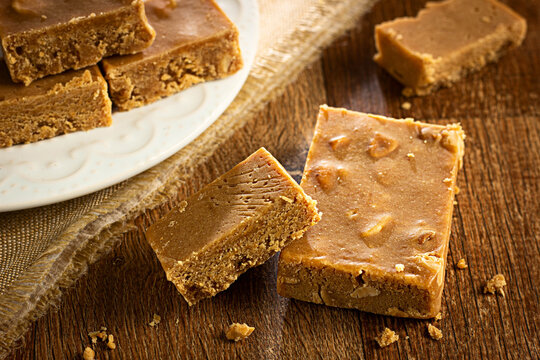Pa&ccedil;oca, Brazilian Typical Peanut Candy on Wooden Table and a Plate