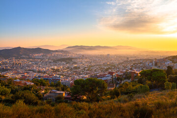 Panoramic picture of Barcelona city captured during sunrise.