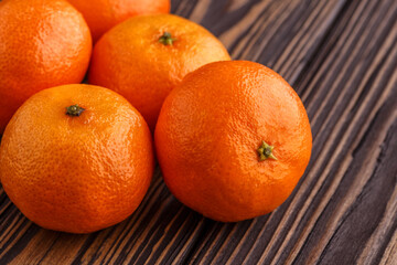 Mandarine orange or tangerine on wooden board