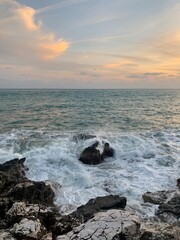 Sunset at the sea, rocky coastline, natural colors