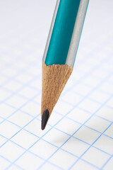 Pencil and squared notebook sheet close-up. Light vertical illustration on the theme of school,...