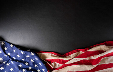 Happy presidents day concept with flag of the United States on black wooden background.