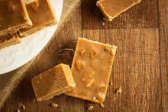 Pa&ccedil;oca, Brazilian Typical Peanut Candy on Wooden Table and a Plate