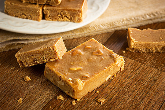 Pa&ccedil;oca, Brazilian Typical Peanut Candy on Wooden Table and a Plate