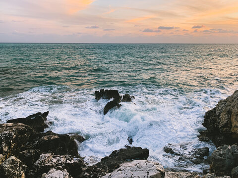 Sunset at the sea, rocky coastline, natural colors