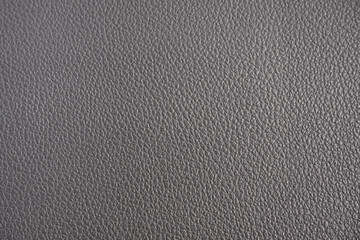 Close up. Dark black leather texture background.