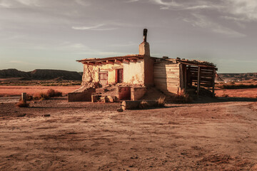 Fototapeta na wymiar Abandoned house in Bardenas Reales desert in Navarra, Spain, captured during sunset.