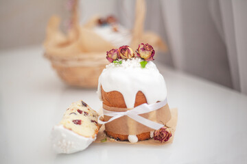 Traditional Russian easter bread on table. The decorarion of kulich are the flower are eating on spring holiday