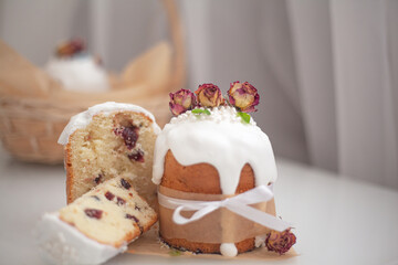 Traditional russian easter bread on table. The decorarion of kulich are the flower are eating on spring holiday