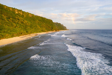 Stunning aerial view of the famous Nyang Nyang beach at the feet of the Uluwatu cliff in Bali, Indonesia