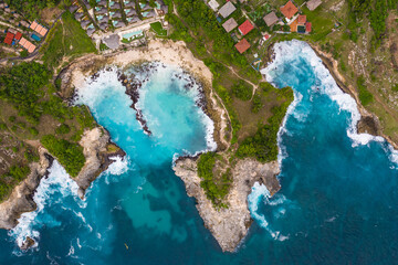 Dramatic top down view of the blue lagoon in the Nusa Ceningan island off the coast of Bali in Indonesia