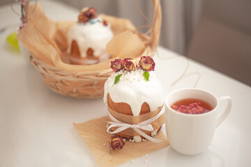 Traditional russian easter bread on table. The decorarion of kulich are the flower are eating on spring holiday
