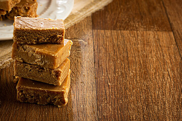 Paçoca, Brazilian Typical Peanut Candy on Wooden Table and a Plate