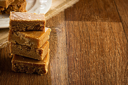 Pa&ccedil;oca, Brazilian Typical Peanut Candy on Wooden Table and a Plate