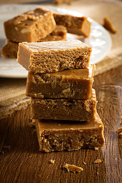 Pa&ccedil;oca, Brazilian Typical Peanut Candy on Wooden Table and a Plate