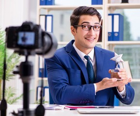 Businessman recording a video for vlog