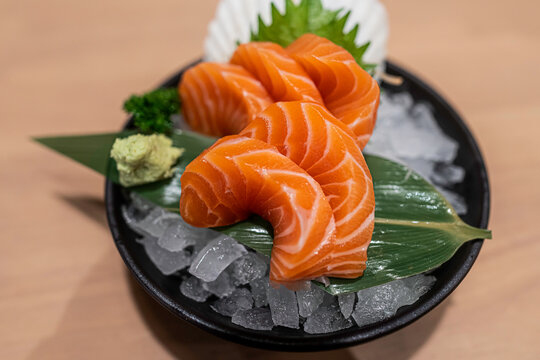 Salmon sashimi in bowl alose up