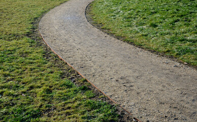 construction of a threshing gravel sidewalk, installation of a steel strip as a curb path. between...