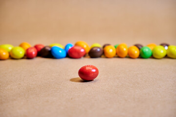 Colorful candies on a beige background